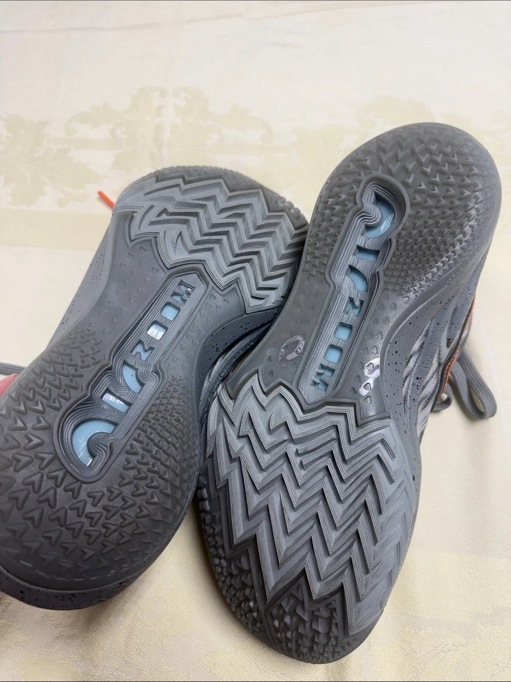 Nike Women’s Gray Sneakers with Orange Stitching